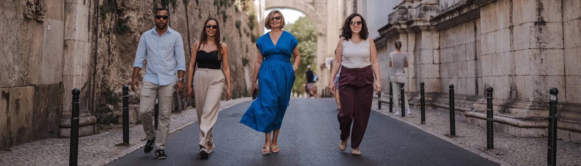 The Travel Lider team walking together down a historic street.
